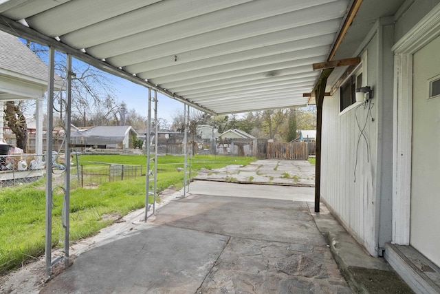 view of patio / terrace featuring a residential view and fence