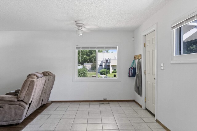 2218 E Hartson Ave, Spokane, WA 99202 - kitchen featuring stainless steel appliances, white cabinets, light tile patterned floors, and dark countertops