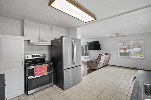 kitchen featuring white cabinets, a wealth of natural light, appliances with stainless steel finishes, and under cabinet range hood