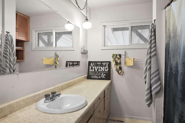 bathroom featuring vanity and plenty of natural light