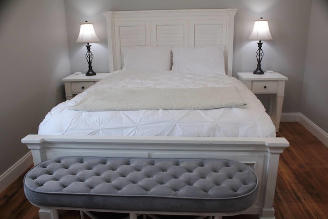 306 2nd St # 3 Id, Mullan, ID 83846 - bedroom with dark wood-type flooring and baseboards