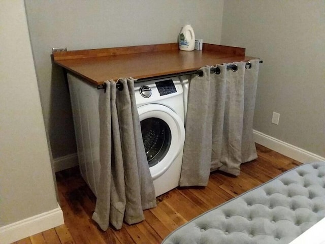 306 2nd St # 3 Id, Mullan, ID 83846 - laundry room featuring washer / dryer, baseboards, and wood finished floors