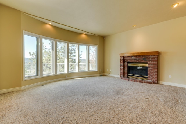 6519 W Kitsap Dr, Spokane, WA 99208 - unfurnished living room with baseboards, recessed lighting, carpet flooring, and a brick fireplace
