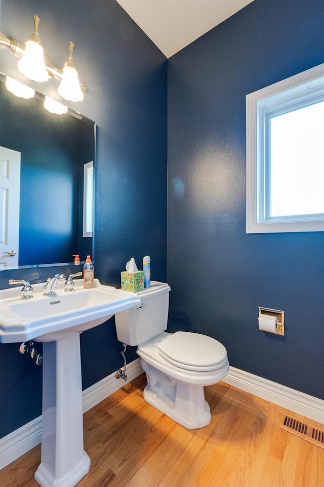 6519 W Kitsap Dr, Spokane, WA 99208 - bathroom with toilet, visible vents, wood finished floors, and baseboards