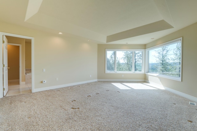 6519 W Kitsap Dr, Spokane, WA 99208 - carpeted spare room with a raised ceiling, visible vents, and baseboards