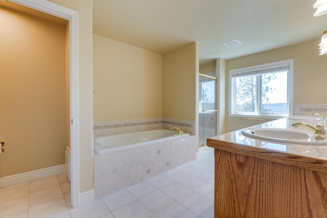 6519 W Kitsap Dr, Spokane, WA 99208 - full bathroom with tile patterned floors, a garden tub, a stall shower, and a sink