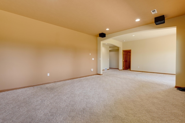 6519 W Kitsap Dr, Spokane, WA 99208 - spare room with recessed lighting, arched walkways, light carpet, baseboards, and visible vents