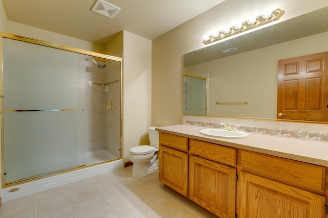 6519 W Kitsap Dr, Spokane, WA 99208 - bathroom featuring vanity, tile patterned floors, toilet, a stall shower, and visible vents