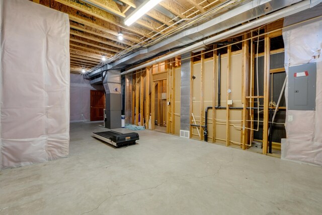 6519 W Kitsap Dr, Spokane, WA 99208 - unfinished below grade area with visible vents, heating unit, and electric panel