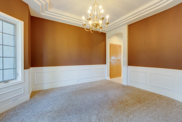 6519 W Kitsap Dr, Spokane, WA 99208 - spare room featuring a wainscoted wall, an inviting chandelier, light colored carpet, and a tray ceiling
