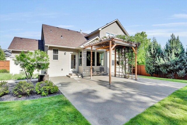 6610 S Springview St, Spokane, WA 99224 - rear view of property featuring a pergola, entry steps, a patio area, and a shingled roof
