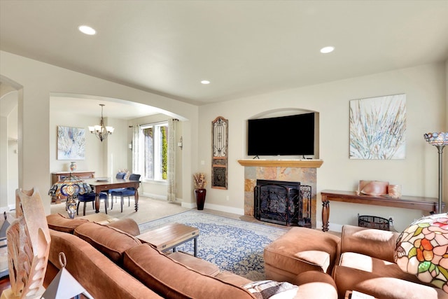 6610 S Springview St, Spokane, WA 99224 - living area featuring arched walkways, a chandelier, a premium fireplace, and recessed lighting