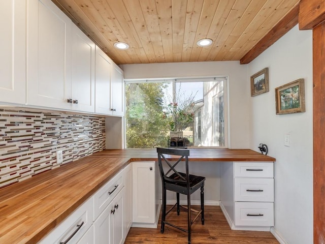 home office with recessed lighting, built in study area, wood ceiling, and wood finished floors