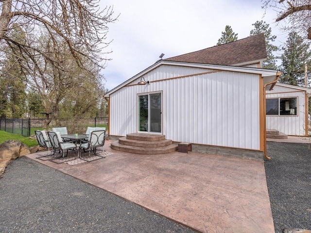 view of patio featuring entry steps and fence