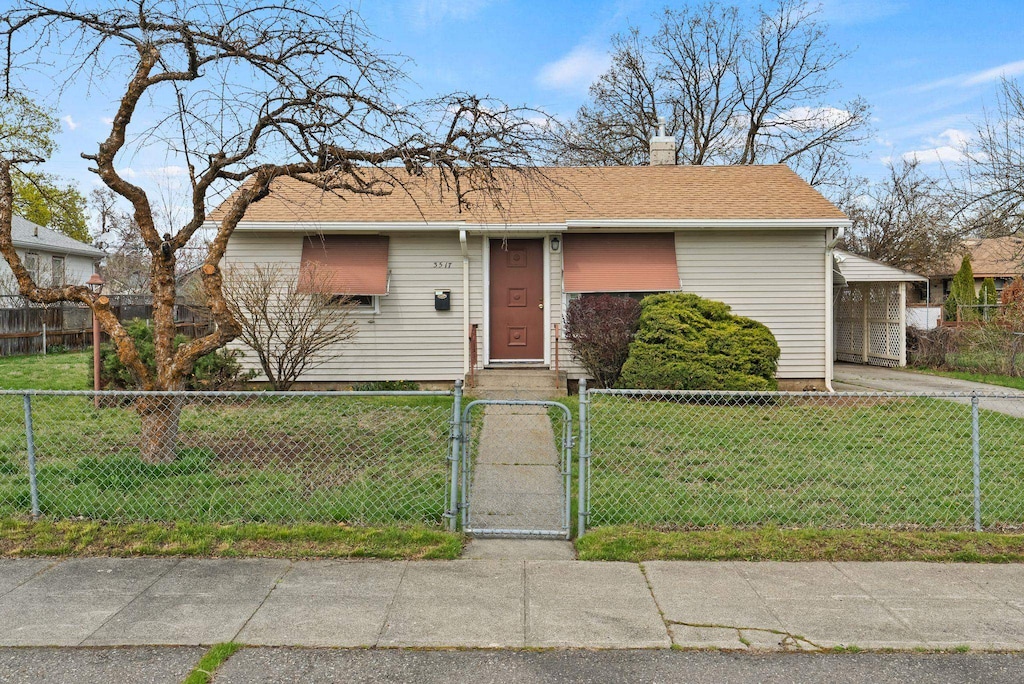 bungalow-style home featuring a chimney, a fenced front yard, a front yard, and a gate