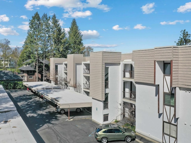 view of property featuring uncovered parking