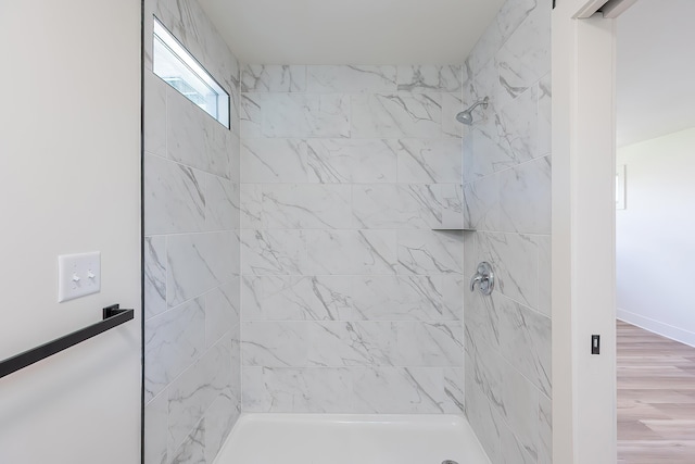 full bath featuring tiled shower