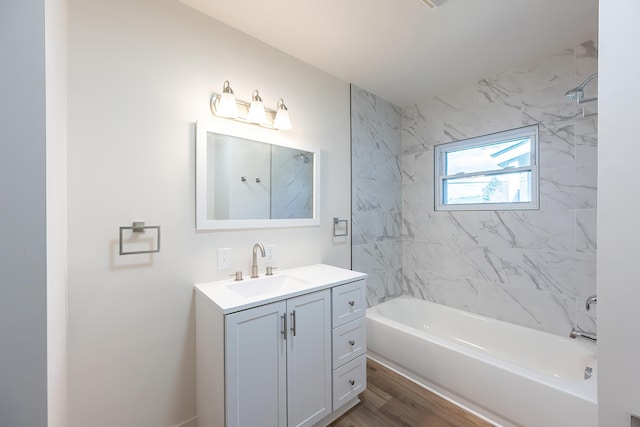 full bathroom featuring shower / bath combination, wood finished floors, and vanity