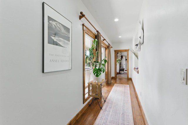 hall with recessed lighting, baseboards, and hardwood / wood-style floors