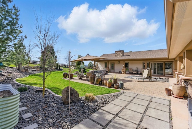 exterior space with a yard and a patio