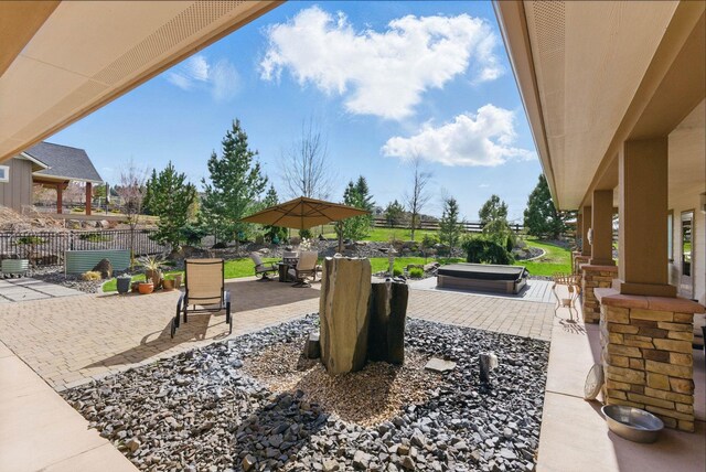 view of patio / terrace featuring outdoor dining space and fence