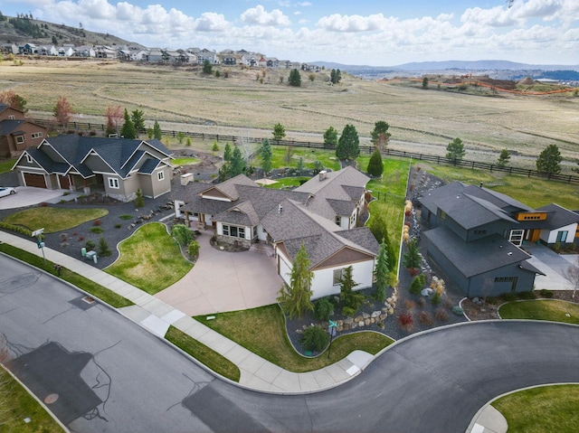 drone / aerial view with a mountain view and a residential view