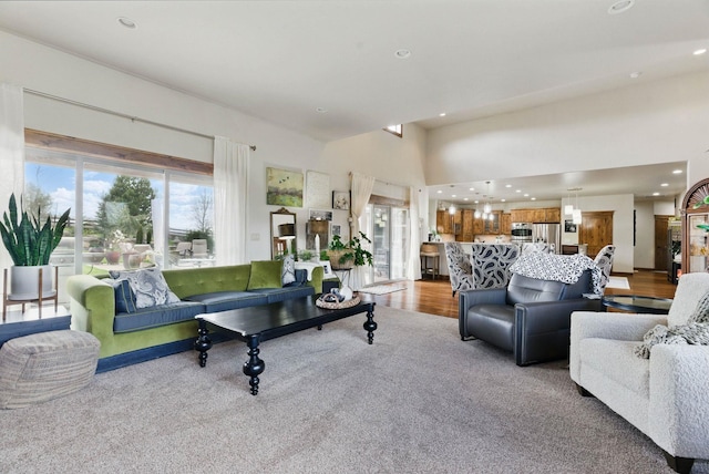 living area with recessed lighting and wood finished floors