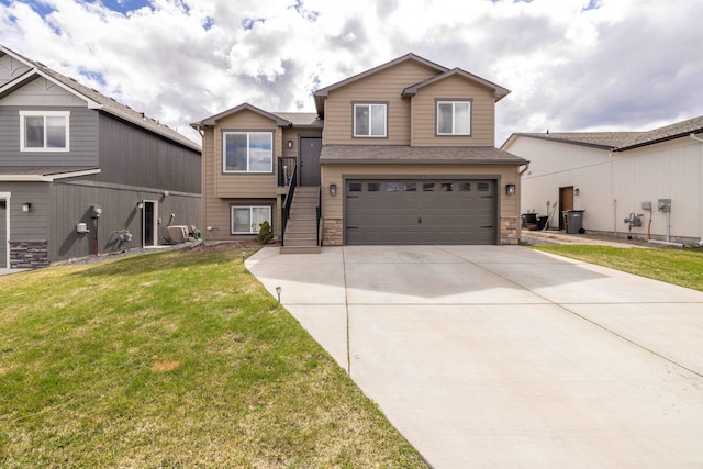 1217 S Greenacres Rd, Greenacres, WA 99016 - split level home featuring concrete driveway, an attached garage, a front lawn, stairway, and stone siding