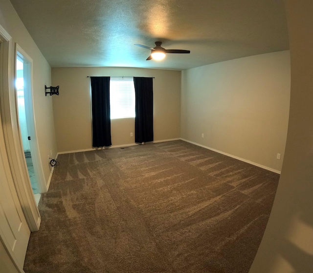 1217 S Greenacres Rd, Greenacres, WA 99016 - empty room featuring plenty of natural light, dark carpet, ceiling fan, and a textured ceiling
