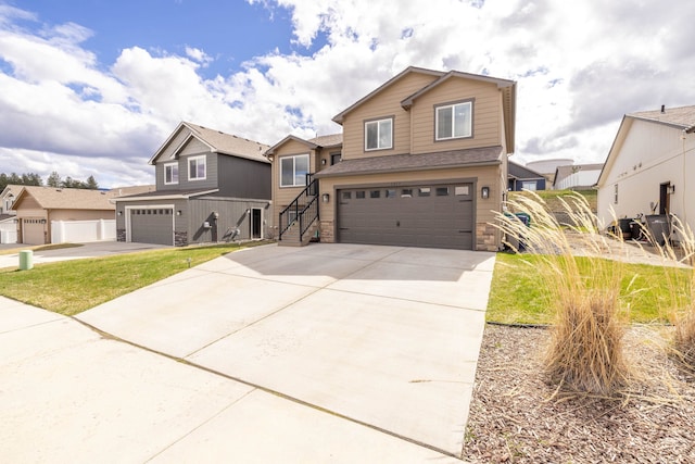 1217 S Greenacres Rd, Greenacres, WA 99016 - view of front of house with an attached garage, driveway, and stone siding