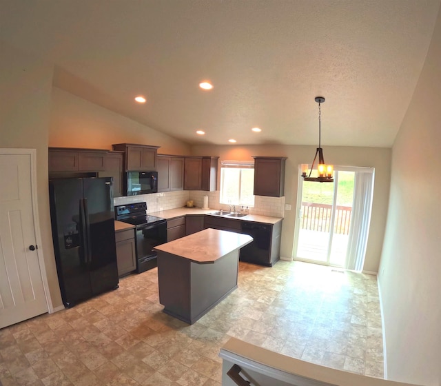 1217 S Greenacres Rd, Greenacres, WA 99016 - kitchen with black appliances, tasteful backsplash, a chandelier, vaulted ceiling, and a kitchen island