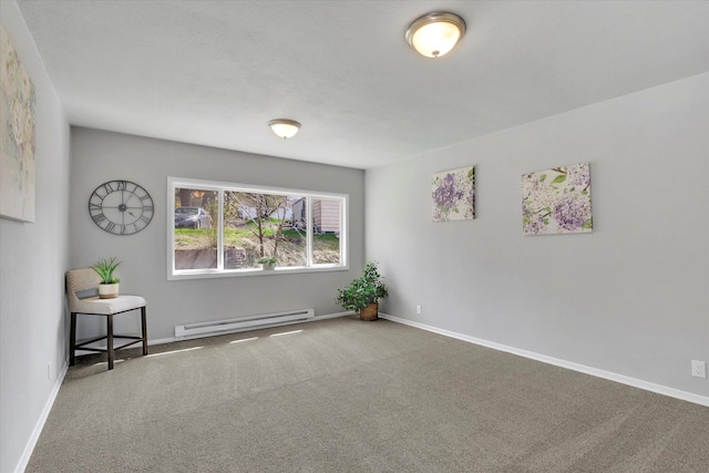 empty room with a baseboard heating unit, baseboards, and carpet
