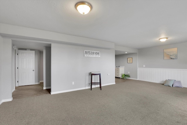 basement with carpet floors and baseboards