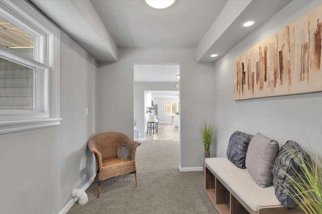 corridor featuring a wealth of natural light, recessed lighting, carpet flooring, and baseboards
