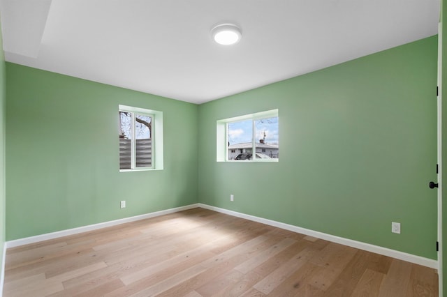 703 E Kiernan Ave, Spokane, WA 99207 - spare room with baseboards and wood finished floors