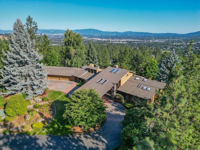 7816 E Gunning Ln, Spokane, WA 99212 - aerial view of property and surrounding area featuring a heavily wooded area and a mountain backdrop