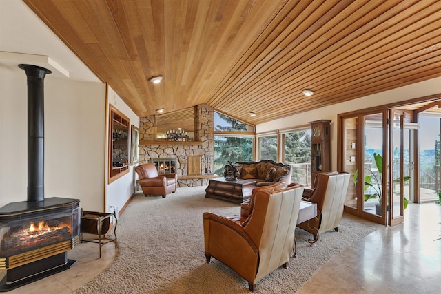 7816 E Gunning Ln, Spokane, WA 99212 - tiled living area featuring wood ceiling, a wood stove, vaulted ceiling, and a stone fireplace