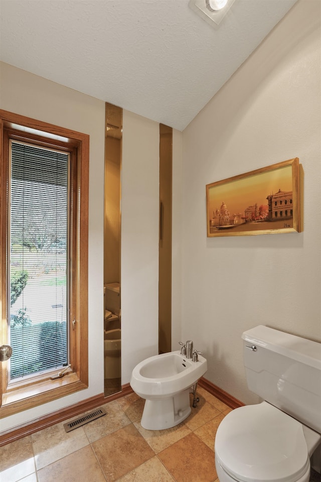 7816 E Gunning Ln, Spokane, WA 99212 - bathroom with toilet and a bidet