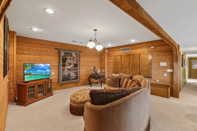 7816 E Gunning Ln, Spokane, WA 99212 - living room featuring light colored carpet, wooden walls, recessed lighting, and a chandelier