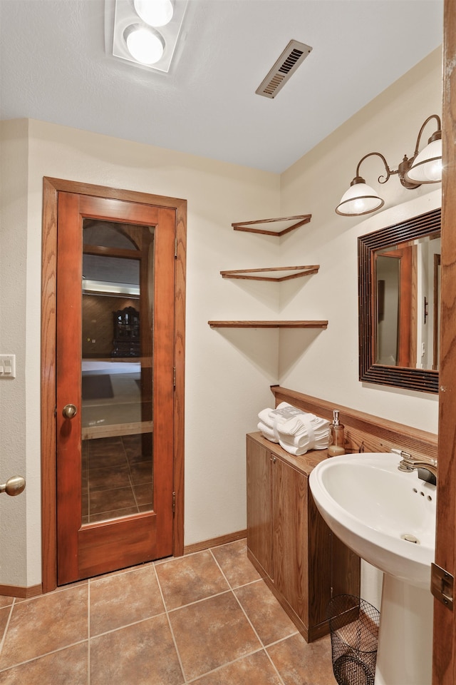 7816 E Gunning Ln, Spokane, WA 99212 - bathroom with tile patterned flooring and baseboards