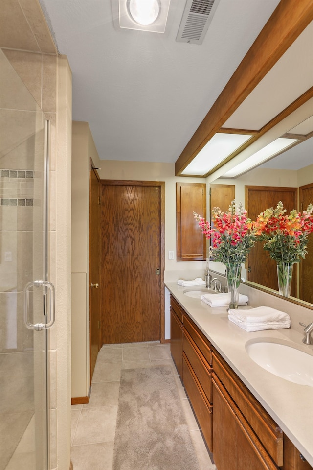 7816 E Gunning Ln, Spokane, WA 99212 - full bath with double vanity, a shower stall, and tile patterned flooring