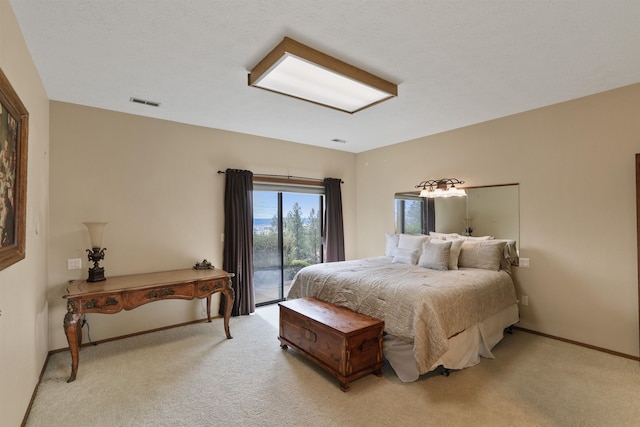 7816 E Gunning Ln, Spokane, WA 99212 - bedroom with access to exterior and light colored carpet