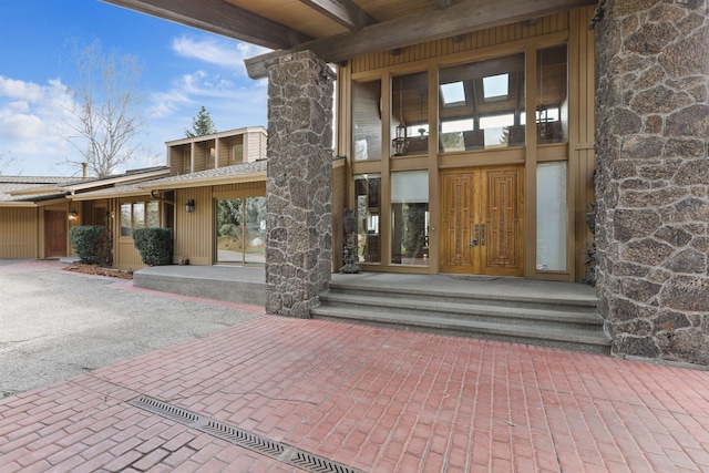7816 E Gunning Ln, Spokane, WA 99212 - property entrance featuring stone siding and roof with shingles