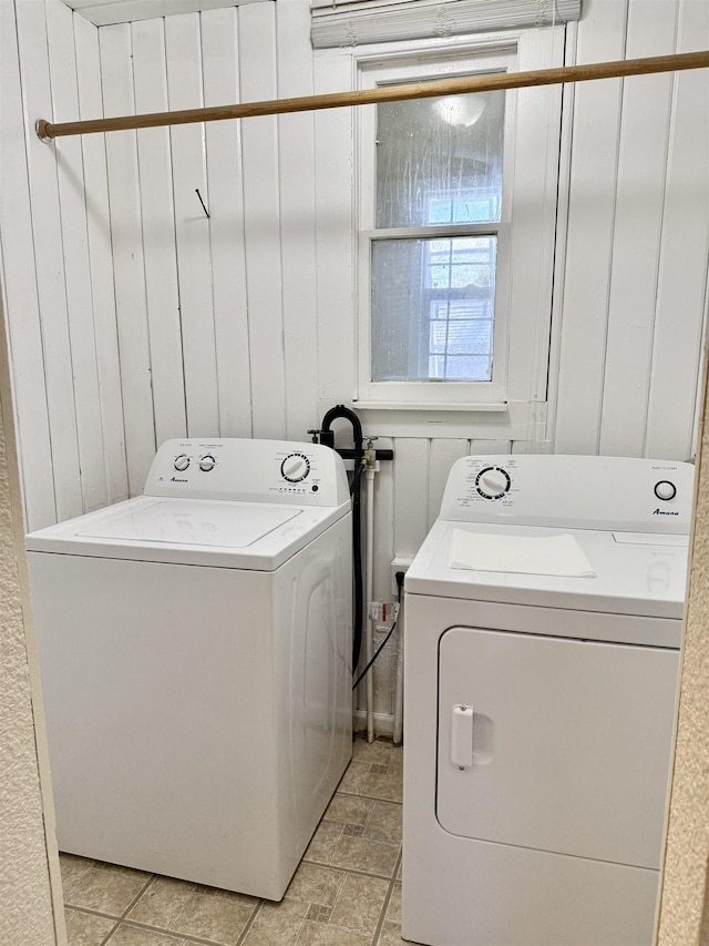 washroom featuring laundry area and separate washer and dryer