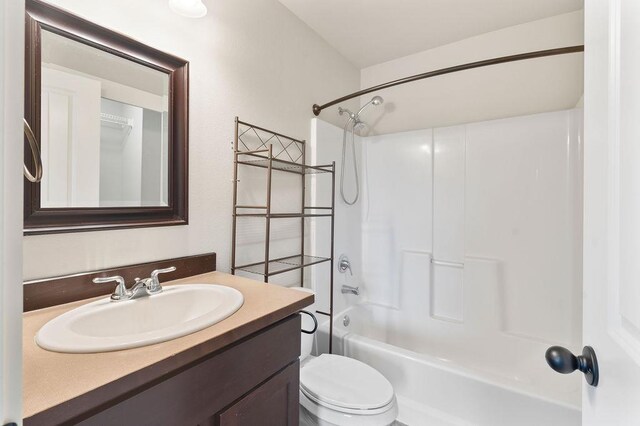 full bath featuring shower / bath combination, vanity, and toilet