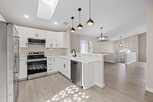 619 W Persimmon Ln, Spokane, WA 99224 - kitchen with visible vents, baseboards, light wood-style flooring, and appliances with stainless steel finishes