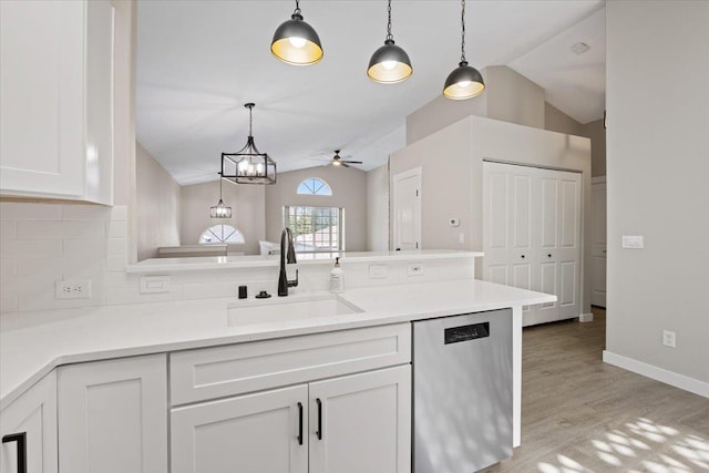 619 W Persimmon Ln, Spokane, WA 99224 - kitchen with white cabinetry, backsplash, lofted ceiling, dishwasher, and a sink