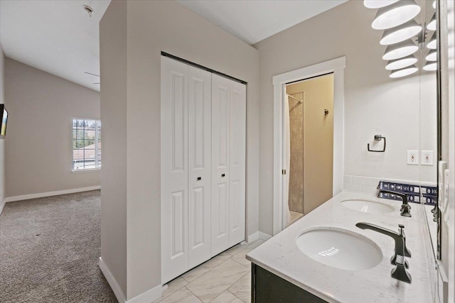619 W Persimmon Ln, Spokane, WA 99224 - bathroom featuring a sink, a closet, and double vanity