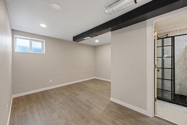 619 W Persimmon Ln, Spokane, WA 99224 - below grade area featuring baseboards, recessed lighting, and wood finished floors