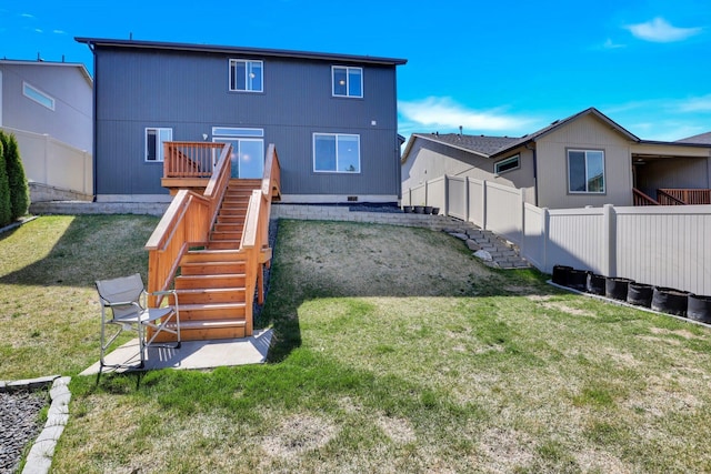 rear view of house featuring stairs and a wooden deck